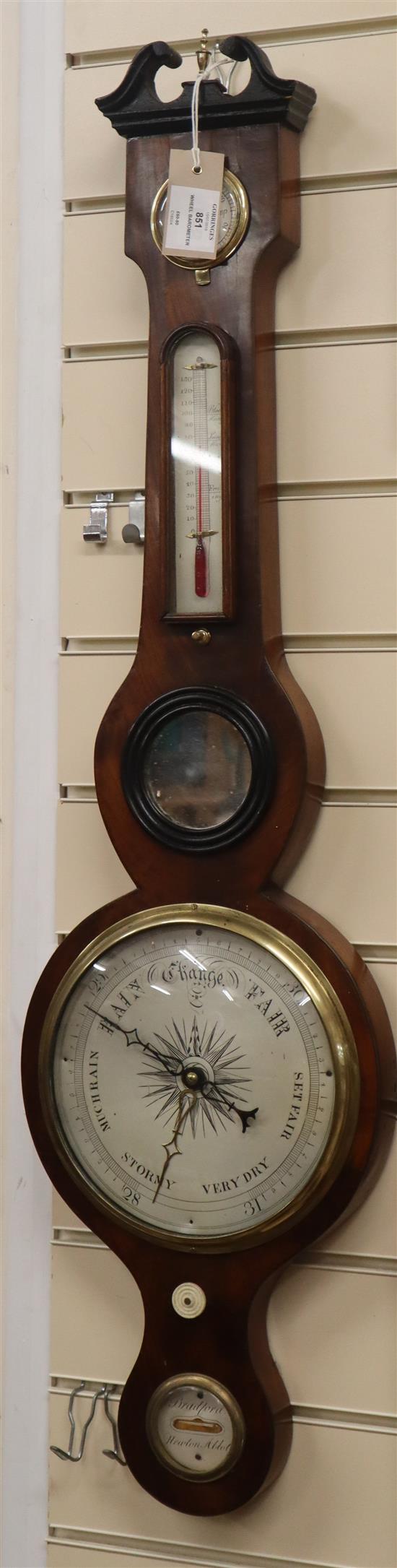 A George III mahogany wheel barometer marked Bradford, Newton Abbot H.95cm